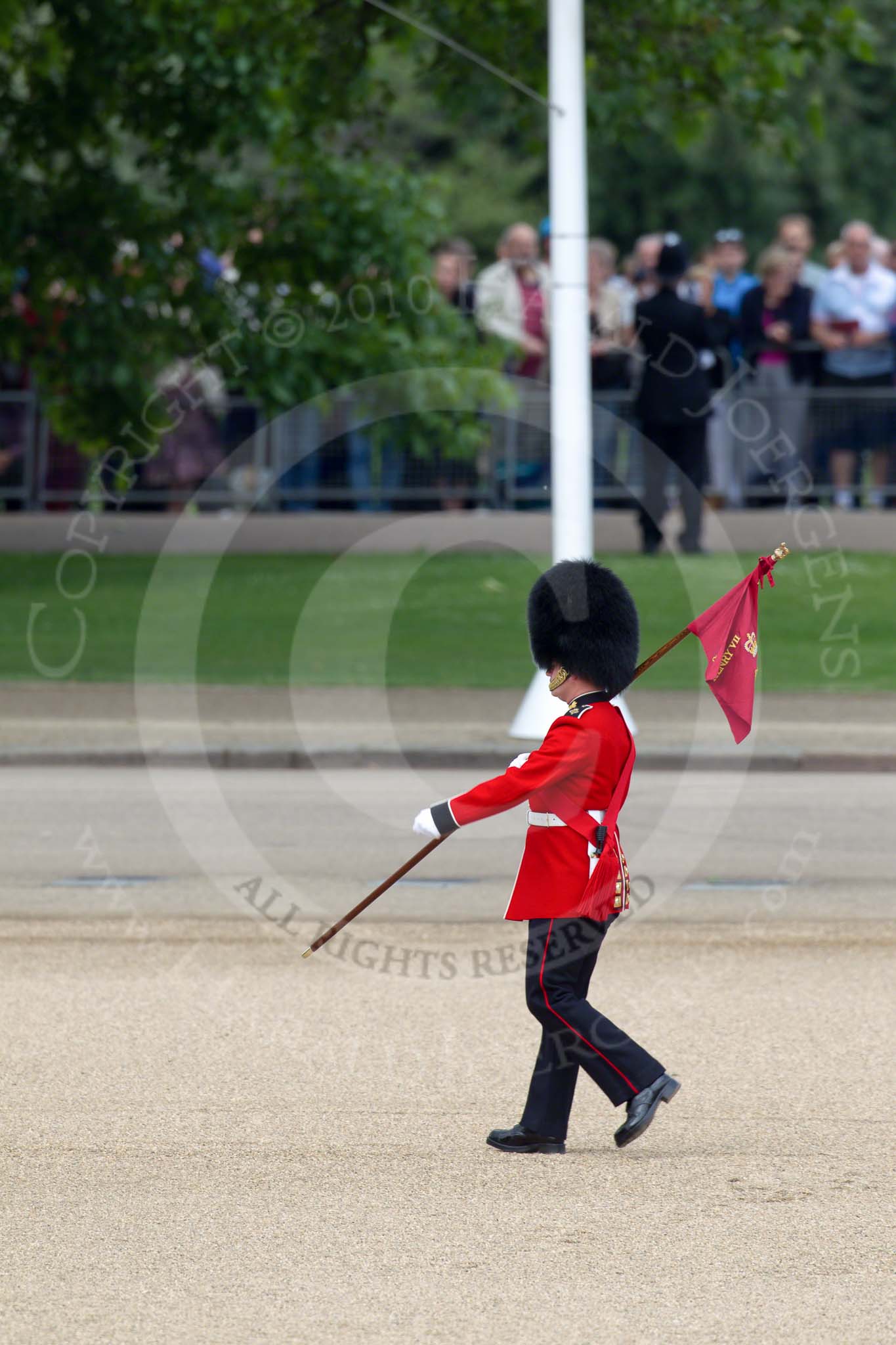 Trooping the Colour 2010: 'March On' - the run-up to the parade. A guardsman of the Grenadier Guards' ('marker') bearing a 'marker flag' that will be used to mark the position of his company on the parade ground..
Horse Guards Parade, Westminster,
London SW1,
Greater London,
United Kingdom,
on 12 June 2010 at 10:18, image #6