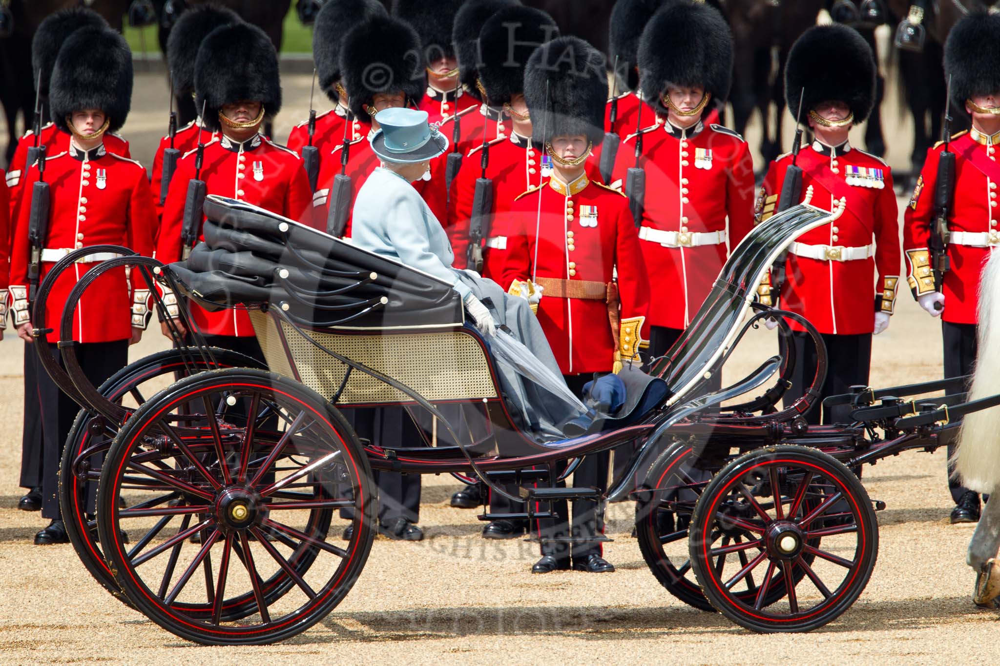 Trooping the Colour 2011: HM The Queen, in the ivory mounted phaeton, during the Inspection of the Line, here No. 2 Guard, B Company Scots Guards..
Horse Guards Parade, Westminster,
London SW1,
Greater London,
United Kingdom,
on 11 June 2011 at 11:03, image #155