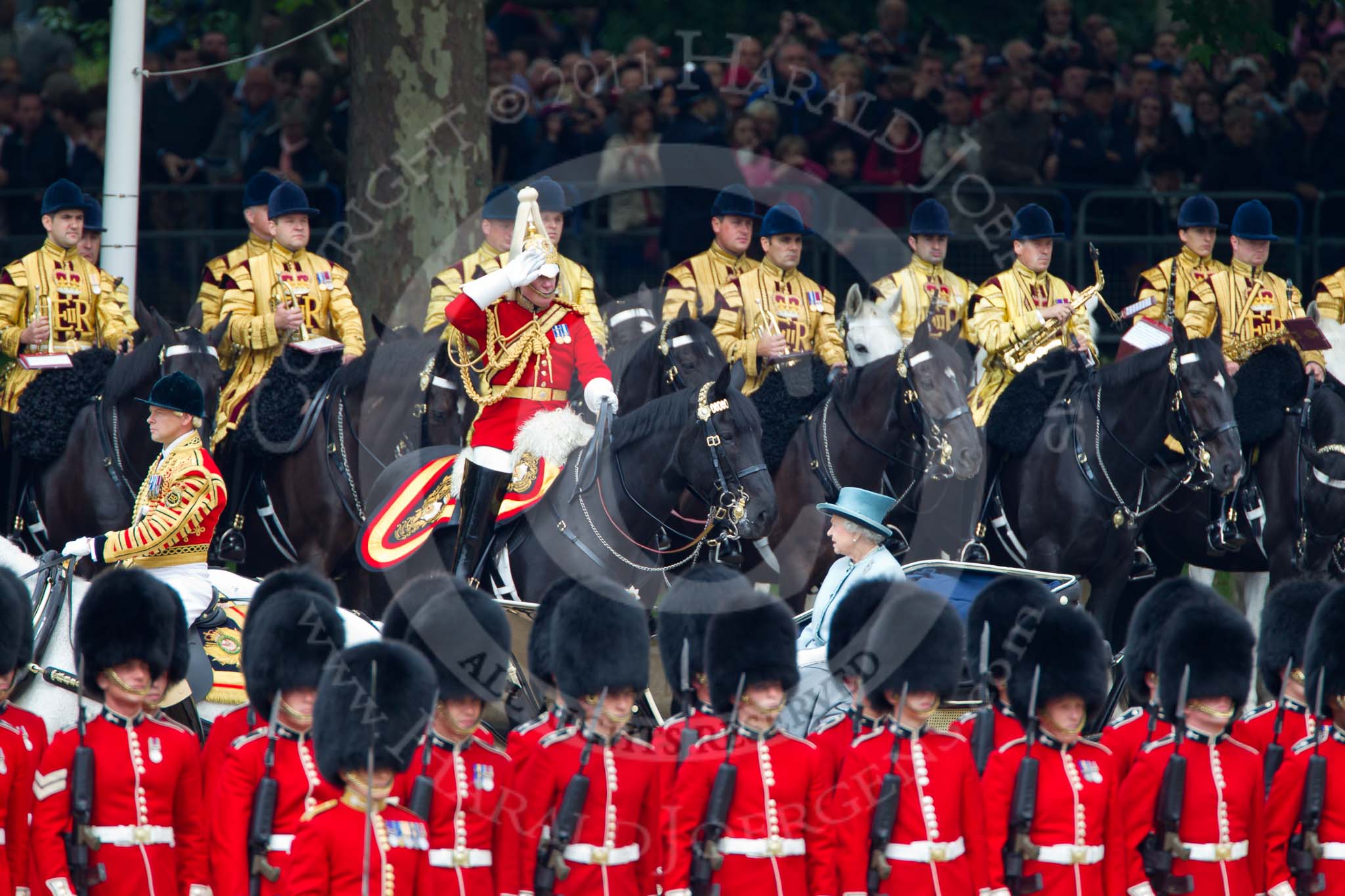 Trooping the Colour 2011: HM The Queen during the inspection of the troops. In charge of the ivory mounted phaeton Jack Hargreaves, Head Coachman. In the front, No. 5 Guard, 1st Battalion Welsh Guards, and in the background the Mounted Bands of the Household Cavalry, with Major K L Davies, The Life Guards, Director of Music, saluting..
Horse Guards Parade, Westminster,
London SW1,
Greater London,
United Kingdom,
on 11 June 2011 at 11:05, image #163