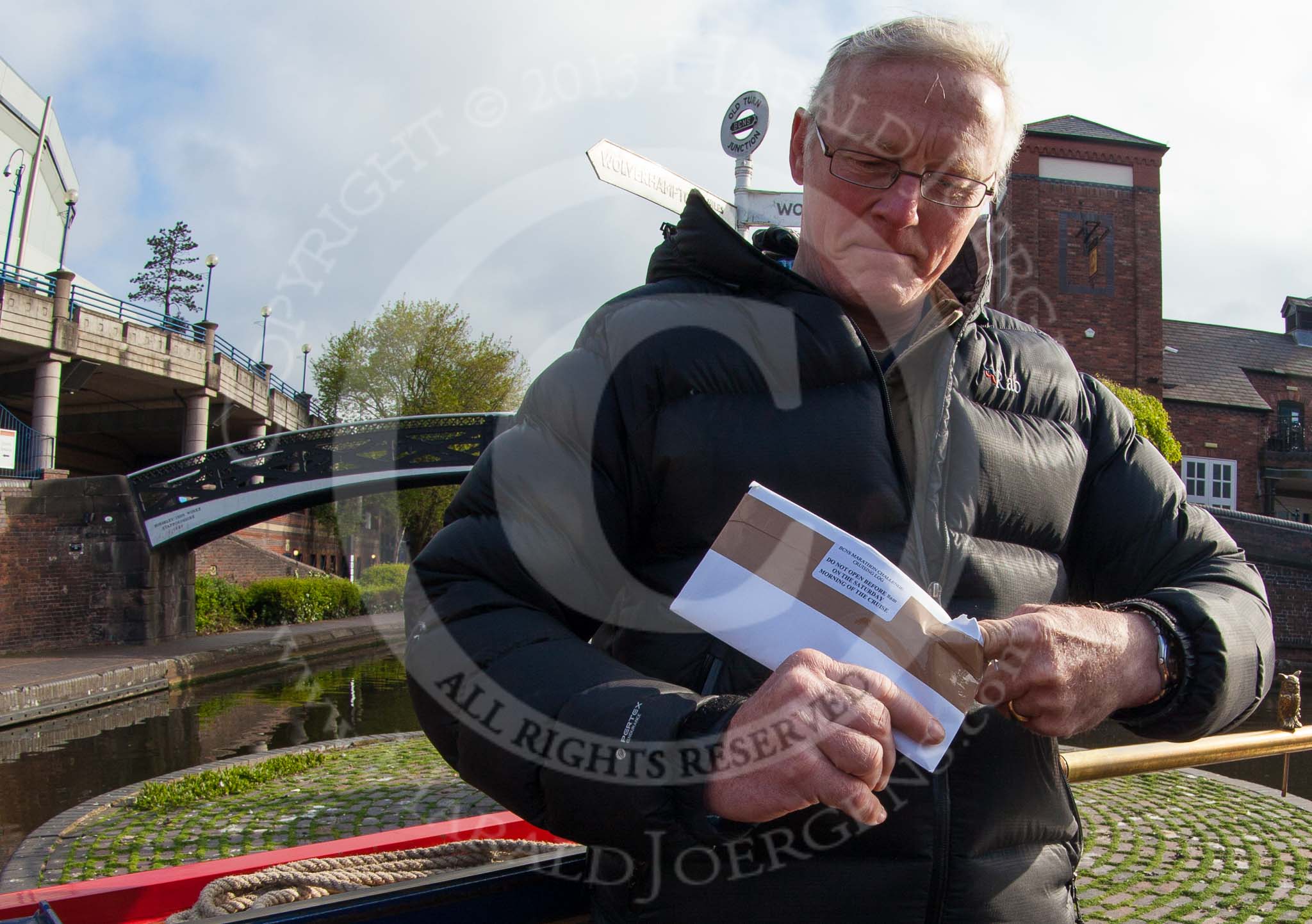 BCN Marathon Challenge 2013: Skipper Charley on board of NB "Felonious Mongoose", at Old Street Junction in the centre of Birmingham, at the start of the BCN Marathon Challenge, opening the sealed envelope with the challenges..
Birmingham Canal Navigation,


United Kingdom,
on 25 May 2013 at 07:59, image #29