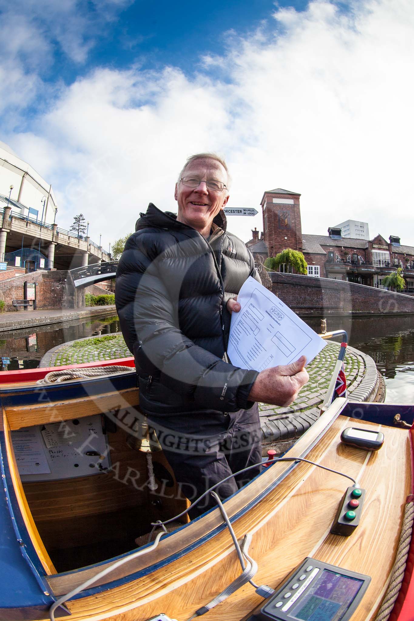 Photo 1305250759015D24760HaraldJoergens BCN Marathon Challenge 2013: Skipper Charley on board of NB "Felonious Mongoose", at Old Street Junction in the centre of Birmingham, at the start of the BCN Marathon Challenge,with the list of challenges from the sealed envelope..
Birmingham Canal Navigation,
United Kingdom,
on 25 May 2013 at 07:59, image #30