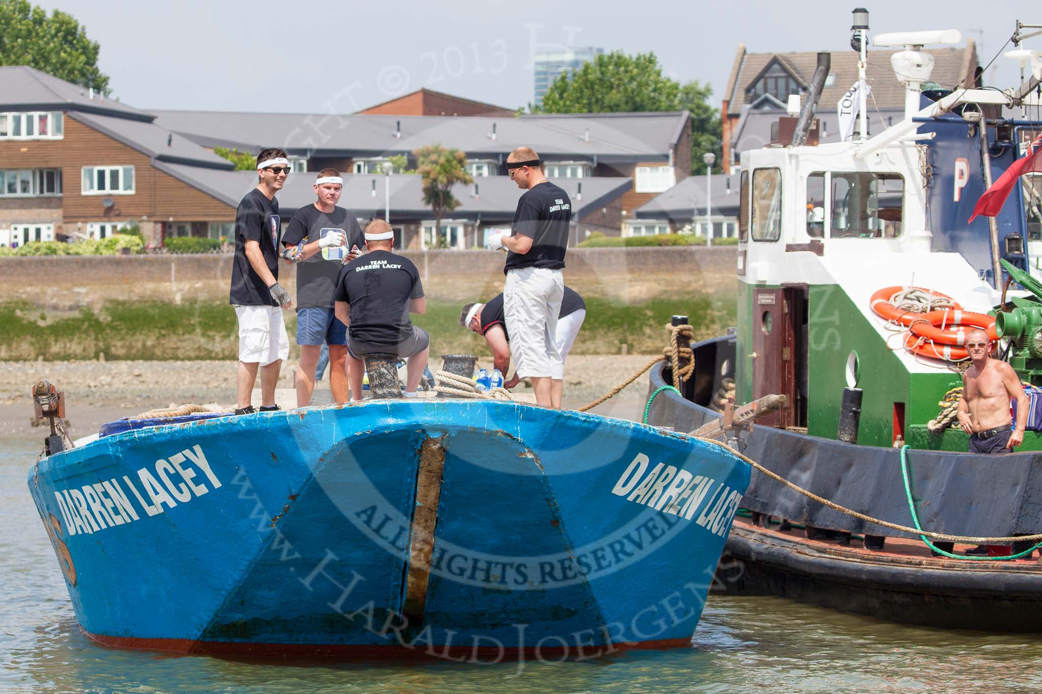 TOW River Thames Barge Driving Race 2013: The crew on board of barge  "Darren Lacey", by Princess Pocahontas,  before the start of the race. On the right tug "Horton"..
River Thames between Greenwich and Westminster,
London,

United Kingdom,
on 13 July 2013 at 12:22, image #69