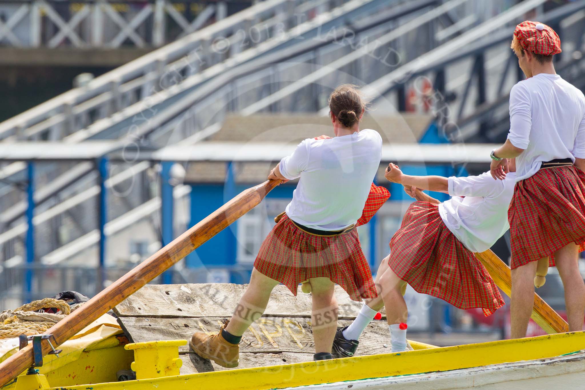 TOW River Thames Barge Driving Race 2013: rowers wearing skirts on the deck of of barge "Hoppy" by GPS Fabrication..
River Thames between Greenwich and Westminster,
London,

United Kingdom,
on 13 July 2013 at 12:36, image #121
