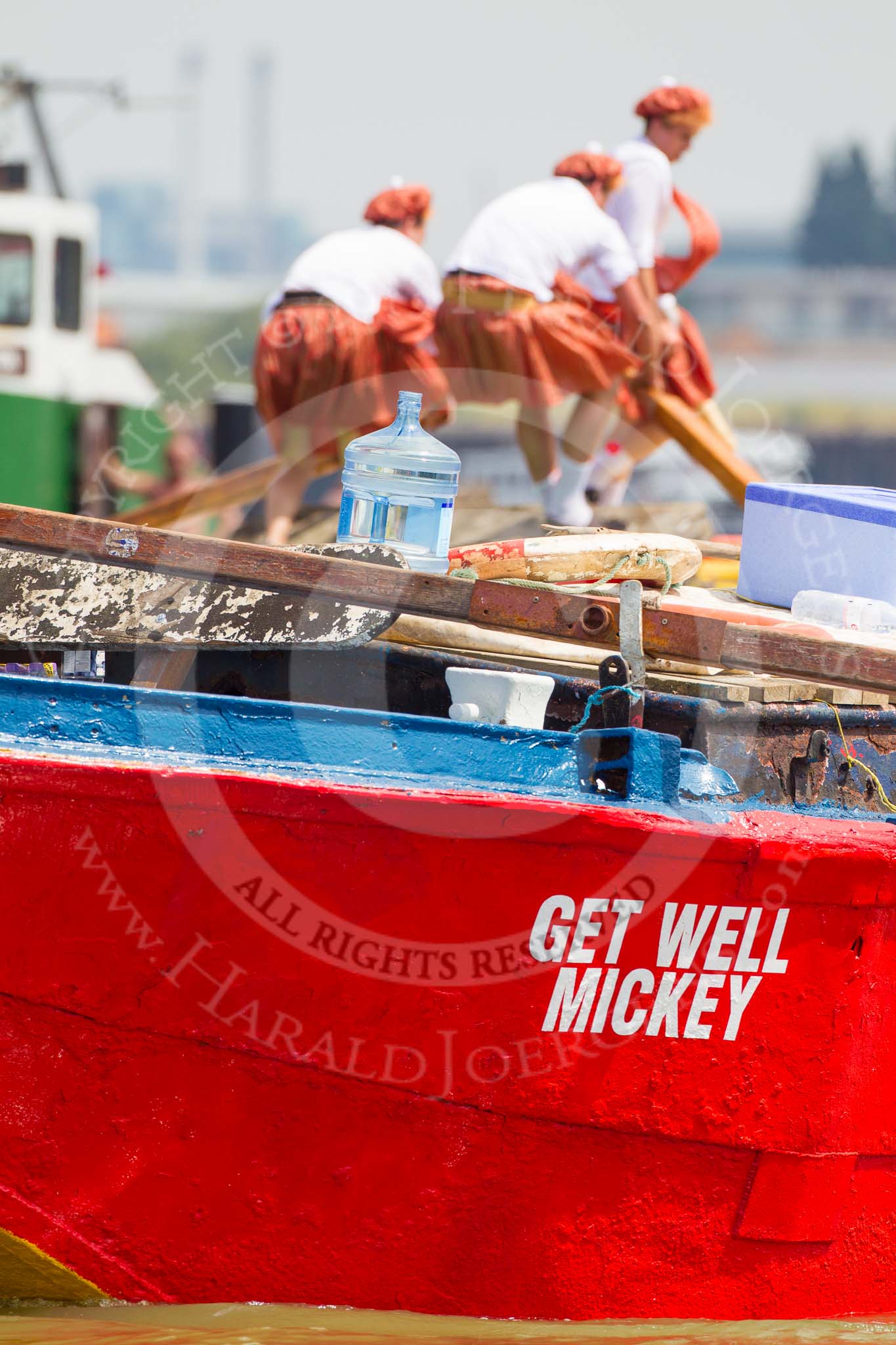 TOW River Thames Barge Driving Race 2013: Rowers on the deck of barge "Hoppy", by GPS Fabrication, seen looking over the deck of barge "Jane", by the RMT Union, during the race..
River Thames between Greenwich and Westminster,
London,

United Kingdom,
on 13 July 2013 at 12:38, image #141