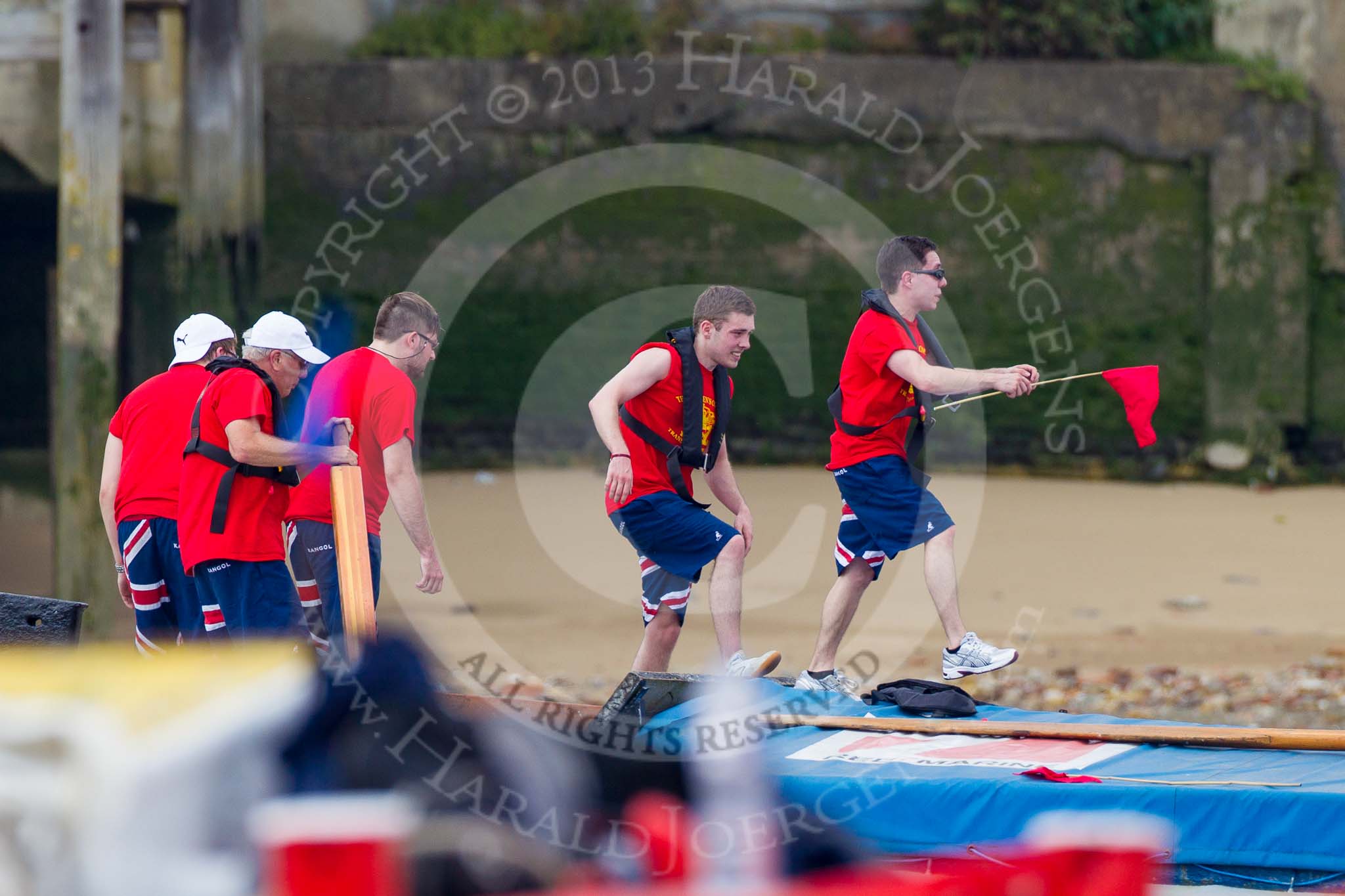 Photo 1307131325271D45008HaraldJoergens TOW River Thames Barge Driving Race 2013: Collecting a pennant from a moored barge - crew members of Barge "Diana", by Trinity Buoy Wharf..
River Thames between Greenwich and Westminster,
London,
United Kingdom,
on 13 July 2013 at 13:25, image #335