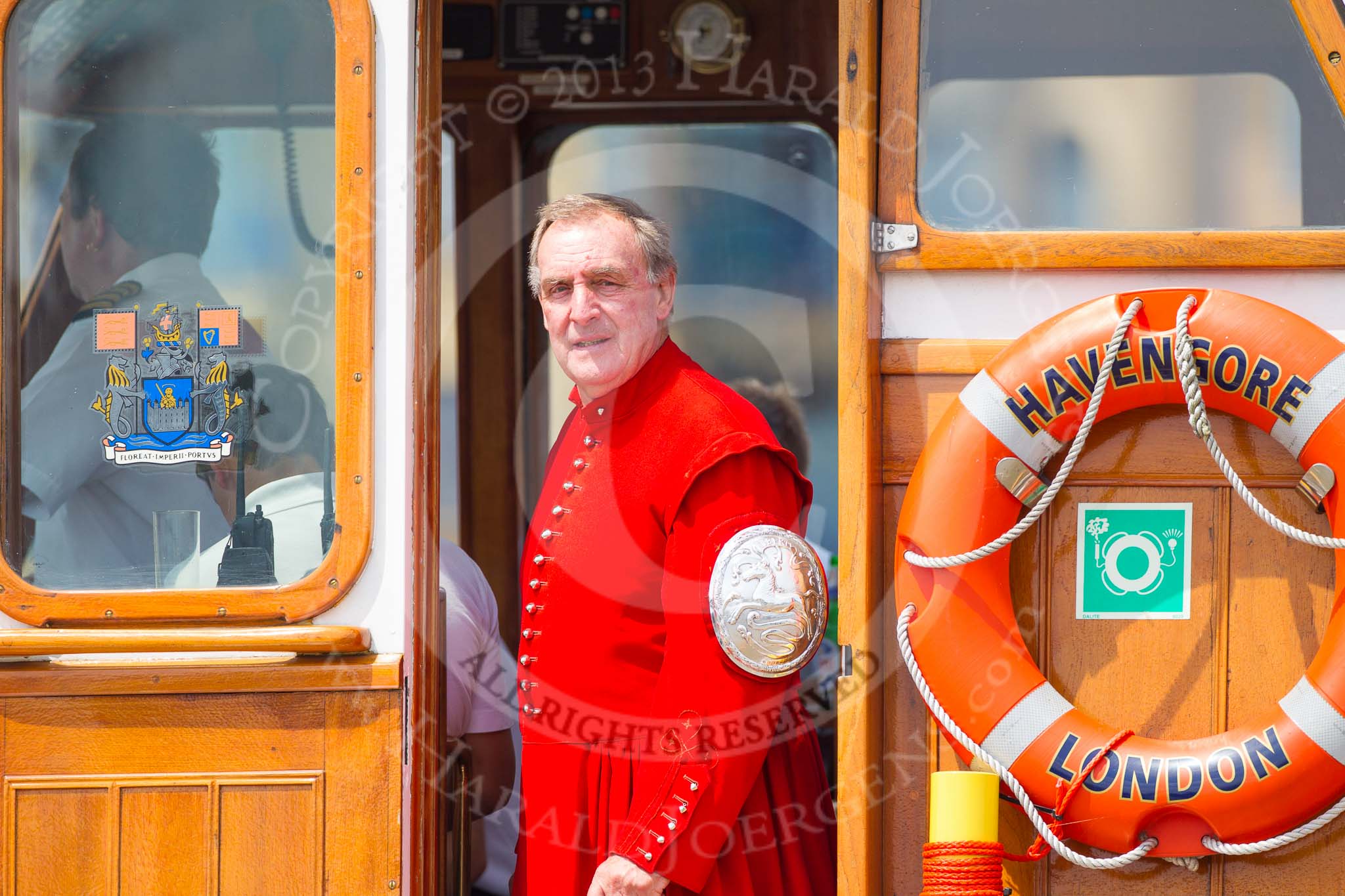 Photo 1307131326081D45028HaraldJoergens TOW River Thames Barge Driving Race 2013: David Gordon, former Master of Watermen's Company, on board of the VIP boat "MV Havengore"..
River Thames between Greenwich and Westminster,
London,
United Kingdom,
on 13 July 2013 at 13:26, image #339