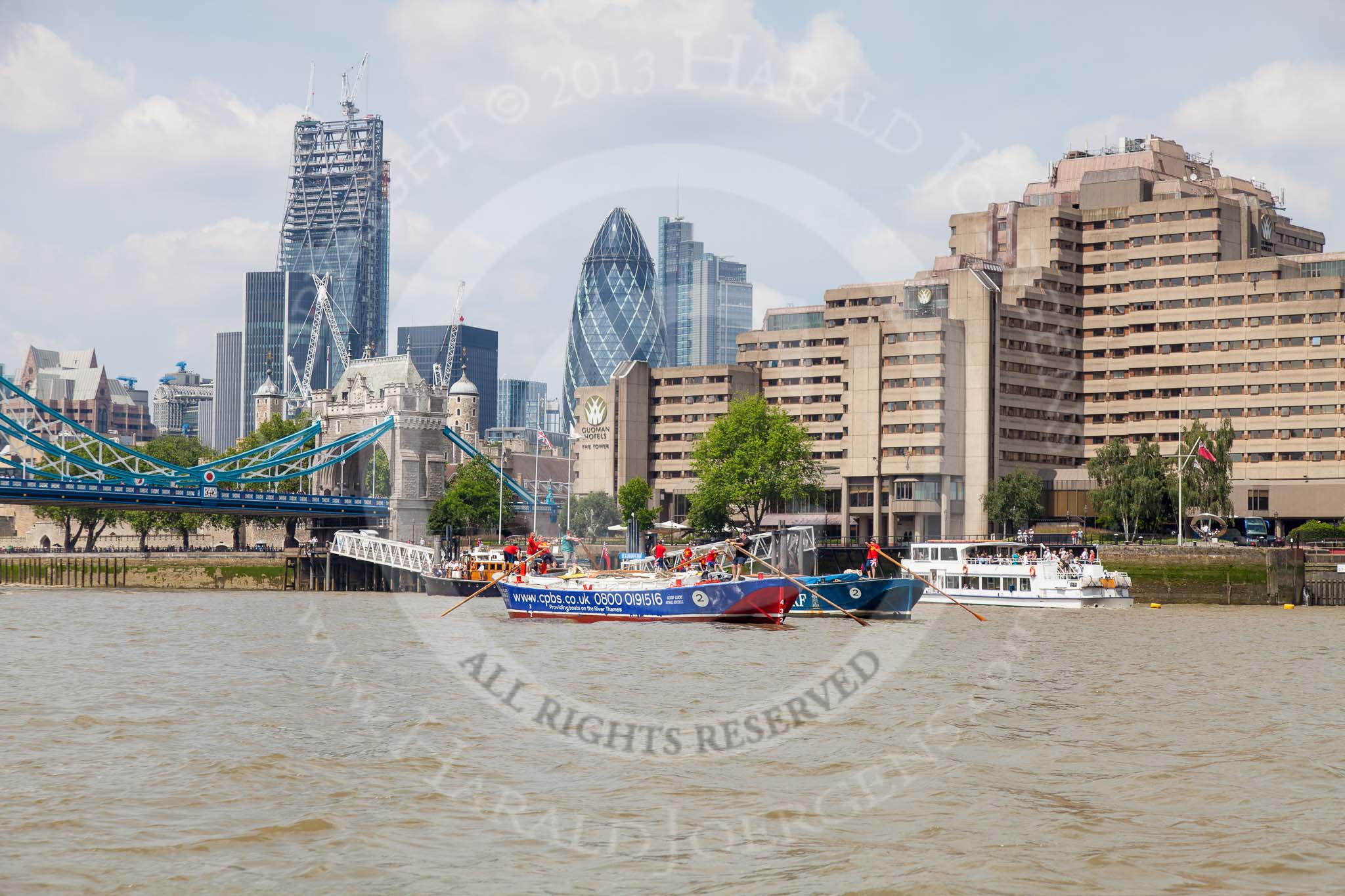 TOW River Thames Barge Driving Race 2013: Barge "Steve Faldo" by Capital Pleasure Boats, and barge "Diana", by Trinity Buoy Wharf, behind, approaching Tower Bridge, with the "Gherkin" building on the right..
River Thames between Greenwich and Westminster,
London,

United Kingdom,
on 13 July 2013 at 13:40, image #376