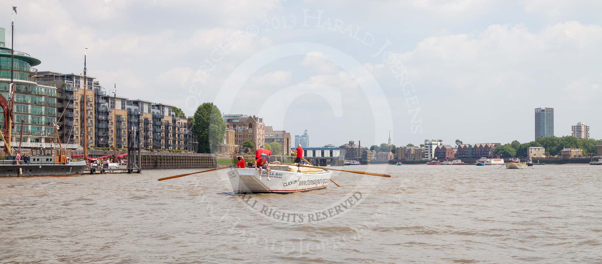 TOW River Thames Barge Driving Race 2013: Barge "Shell Bay" by South Dock Marina, passing modern buildings at Wapping Hight Street..
River Thames between Greenwich and Westminster,
London,

United Kingdom,
on 13 July 2013 at 13:43, image #380