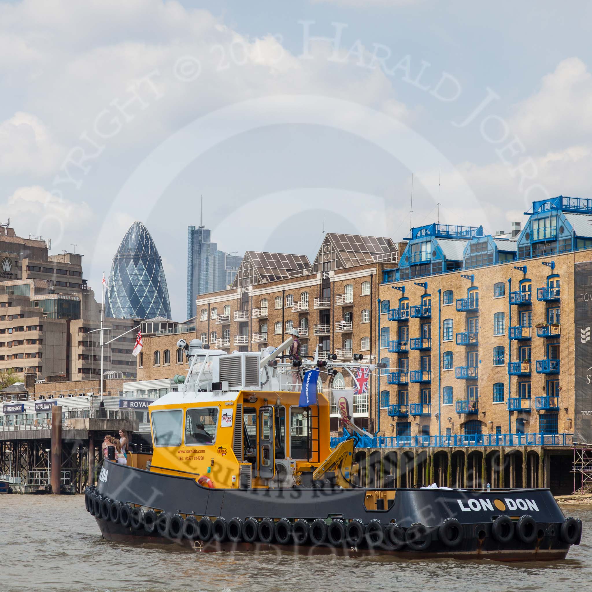 TOW River Thames Barge Driving Race 2013: The S. Walsh tug "SWS Breda"passing the Royal Navy "HMS President" andd the "Gherkin" building..
River Thames between Greenwich and Westminster,
London,

United Kingdom,
on 13 July 2013 at 13:43, image #382