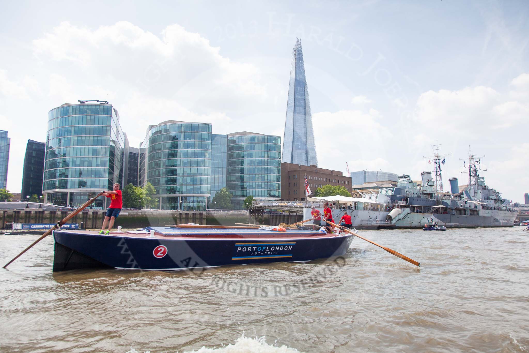 TOW River Thames Barge Driving Race 2013: Barge "Blackwall", by the Port of London Authority, approaching HMS Belfast, with the Shard building behind..
River Thames between Greenwich and Westminster,
London,

United Kingdom,
on 13 July 2013 at 13:46, image #392