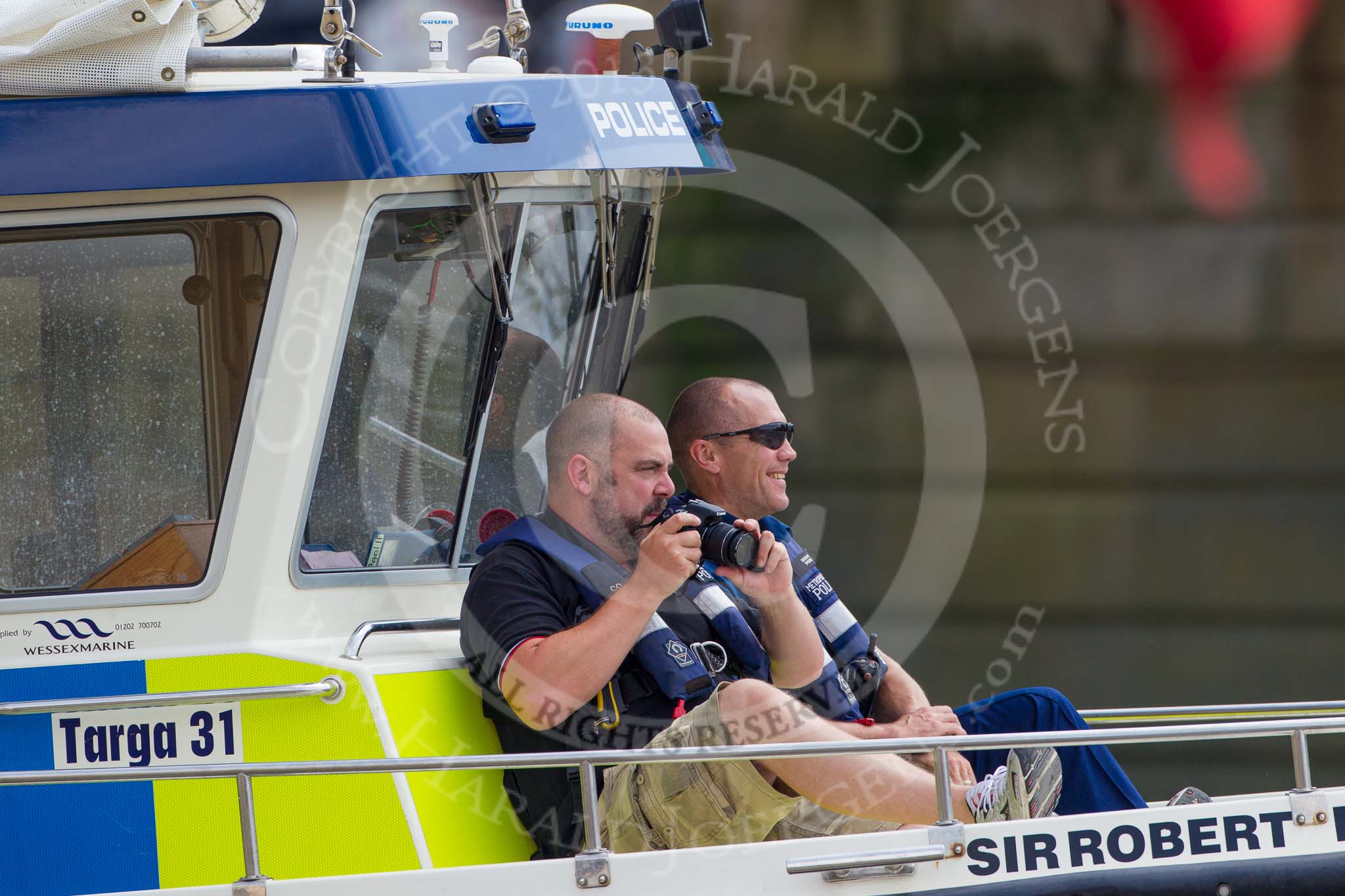 TOW River Thames Barge Driving Race 2013: Metropolitan Police officers on board of "Sir Robert Peel"..
River Thames between Greenwich and Westminster,
London,

United Kingdom,
on 13 July 2013 at 13:52, image #401