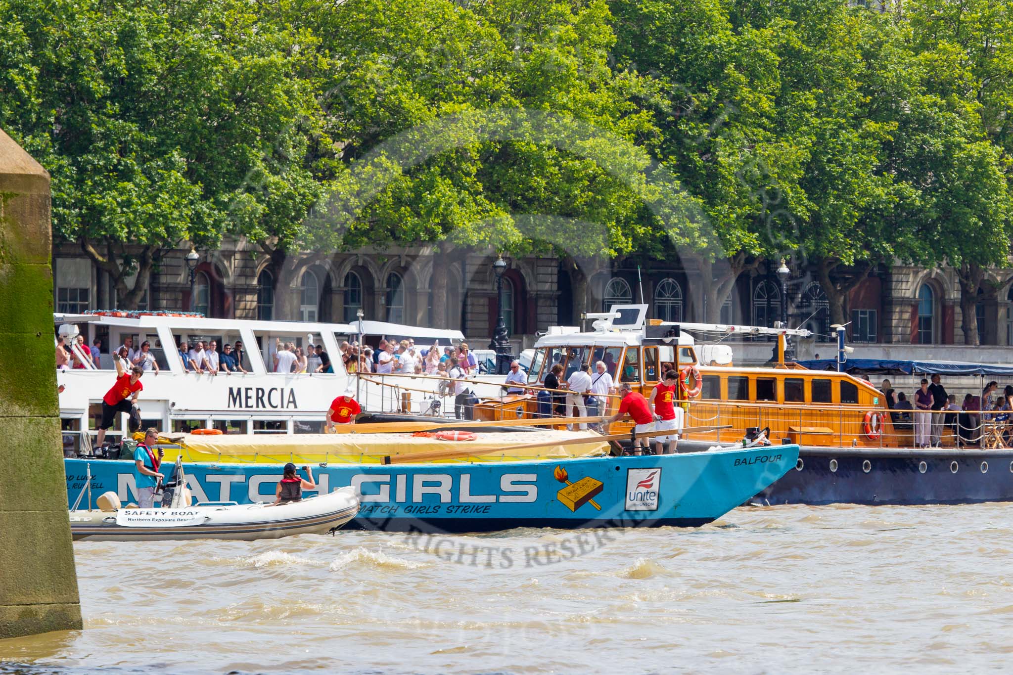 TOW River Thames Barge Driving Race 2013: Barge "The Matchgirls" by Unite the Union, behind the finish line at Westminster Bridge. On the right MV Havengore, hosting VIP guests..
River Thames between Greenwich and Westminster,
London,

United Kingdom,
on 13 July 2013 at 14:37, image #500