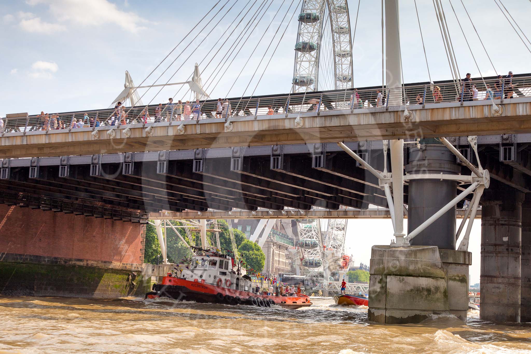 TOW River Thames Barge Driving Race 2013: Tug "Aicirton" pulling barge "Jane", by the RMT Union, through Hungerford Bridge, in front of the London Eye..
River Thames between Greenwich and Westminster,
London,

United Kingdom,
on 13 July 2013 at 14:46, image #522