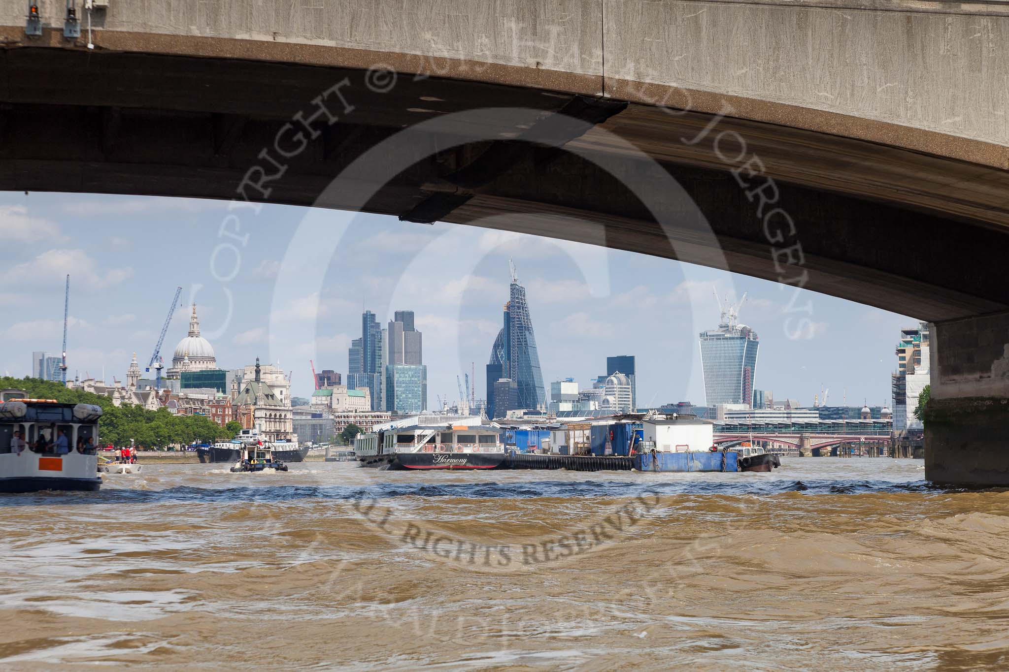 TOW River Thames Barge Driving Race 2013: The London sklyline, seen from the river through Waterloo Bridge, with St. Pauls, the Gherkin, Cheesegrater, and Walkie Talkie..
River Thames between Greenwich and Westminster,
London,

United Kingdom,
on 13 July 2013 at 14:47, image #525