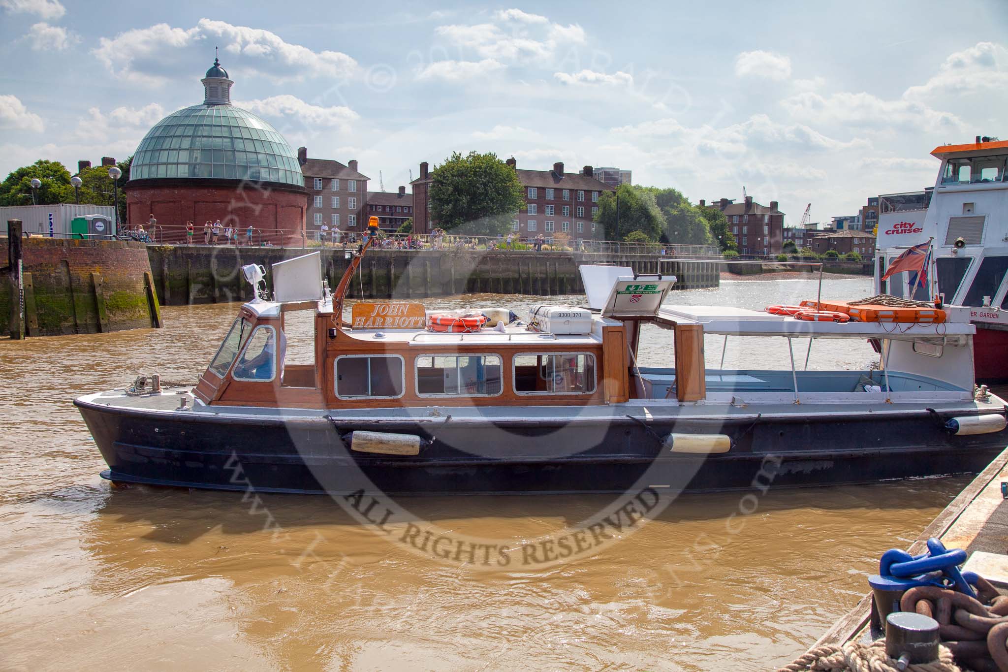 Photo 1307131530475D24843HaraldJoergensE2465 TOW River Thames Barge Driving Race 2013: The high speed Thames Launch "John Harriot", by Thames Executive Charters, leaving Greenwich pier..
River Thames between Greenwich and Westminster,
London,
United Kingdom,
on 13 July 2013 at 15:30, image #554