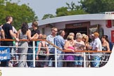 TOW River Thames Barge Driving Race 2013: Passengers on board the "Golden Jubilee" studying the race programme..
River Thames between Greenwich and Westminster,
London,

United Kingdom,
on 13 July 2013 at 11:31, image #28