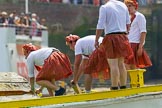 TOW River Thames Barge Driving Race 2013: rowers wearing skirts on the deck of of barge "Hoppy" by GPS Fabrication..
River Thames between Greenwich and Westminster,
London,

United Kingdom,
on 13 July 2013 at 12:36, image #124