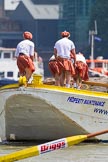 TOW River Thames Barge Driving Race 2013: Rowers wearing skirts on the deck of of barge "Hoppy" by GPS Fabrication..
River Thames between Greenwich and Westminster,
London,

United Kingdom,
on 13 July 2013 at 12:38, image #138