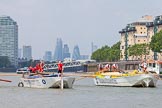 TOW River Thames Barge Driving Race 2013: Barge "Hoppy", by GPS Fabrication, approaching Masthouse Terrace Pier. On the left barge "Spirit of Mountabatten", by Mechanical Movements and Enabling Services Ltd. In the background the skyscrapers of the City of London. On the very left an oar of barge "Darren Lacey"..
River Thames between Greenwich and Westminster,
London,

United Kingdom,
on 13 July 2013 at 12:41, image #171