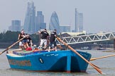 TOW River Thames Barge Driving Race 2013: Rear view of barge "Darren Lacey", by Princess Pocahontas, during the race, approaching MasthouseTerrace Pier. In the background the skyscrapers of the City of London, including the "Gherkin"..
River Thames between Greenwich and Westminster,
London,

United Kingdom,
on 13 July 2013 at 12:41, image #175
