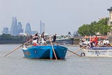 TOW River Thames Barge Driving Race 2013: Rear view of barge "Darren Lacey", by Princess Pocahontas, during the race, approaching Masthouse Terrace Pier. In the background the skyscrapers of the City of London, including the "Gherkin". On the right of "Darren Lacey" is barge "Spirit of Mountabatten", by Mechanical Movements and Enabling Services Ltd..
River Thames between Greenwich and Westminster,
London,

United Kingdom,
on 13 July 2013 at 12:42, image #178