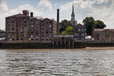TOW River Thames Barge Driving Race 2013: Thames Tunnel Mill, a former warehouse converted to a residential building. In the background the spire od St Mary the Virgin..
River Thames between Greenwich and Westminster,
London,

United Kingdom,
on 13 July 2013 at 13:30, image #352