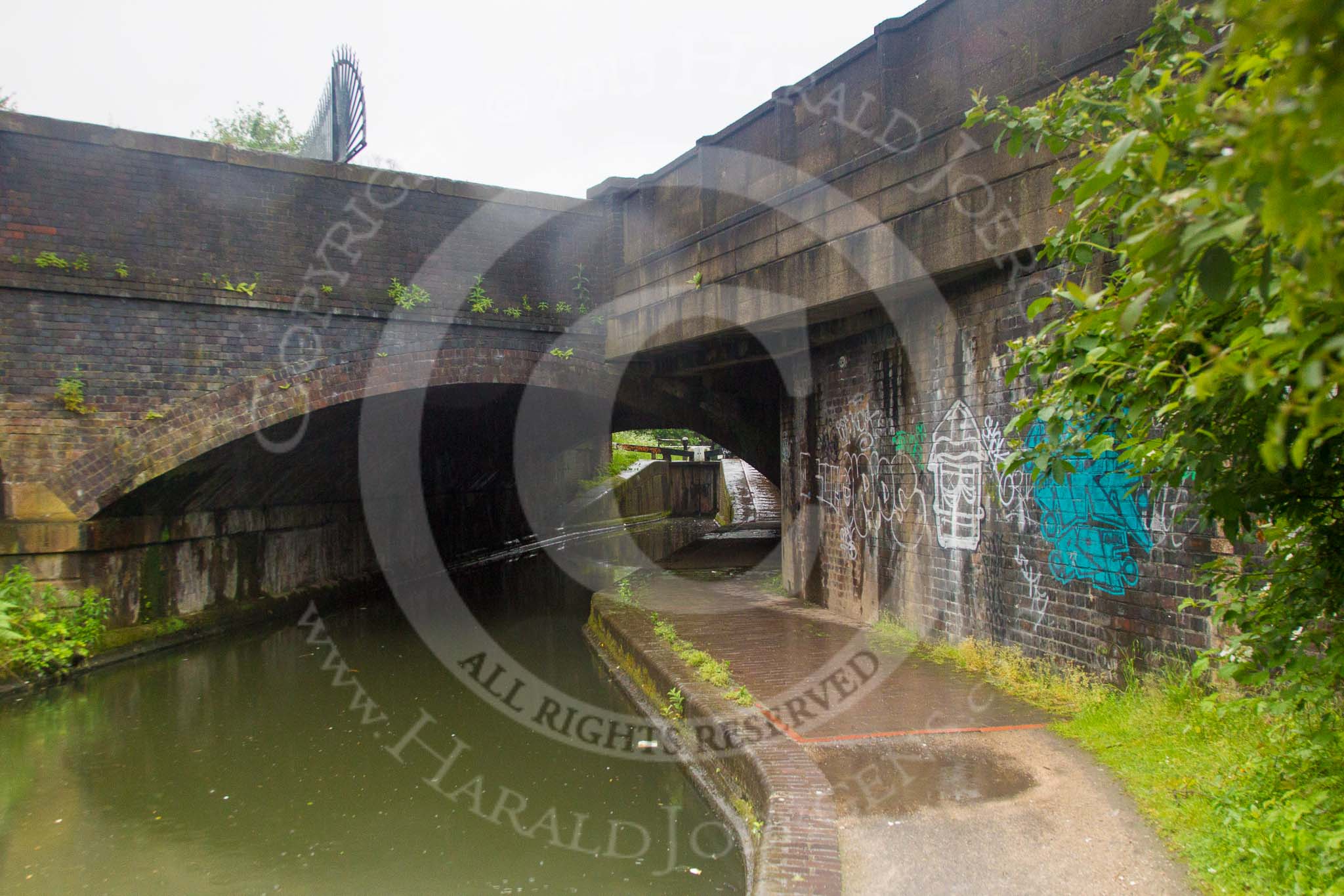 BCN Marathon Challenge 2014: Bridge 104 at Garrison Locks on the Grand Union Canal. Two bridges in one - the older brick structure on the left, and the newer concrete bridge built right through it.
Birmingham Canal Navigation,


United Kingdom,
on 24 May 2014 at 09:02, image #81