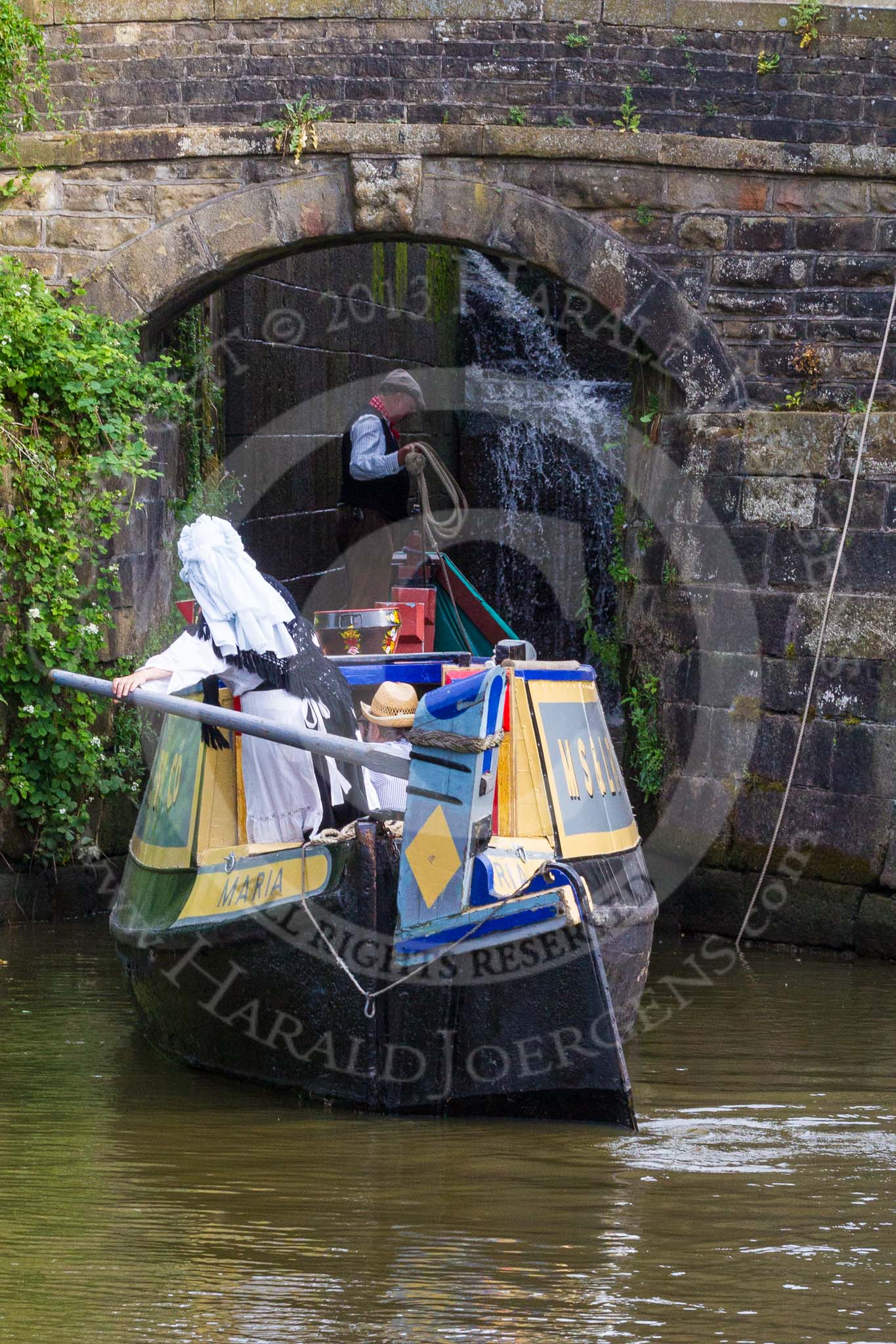 : Barbara Homes (Ashton Packet Boat Co) wearing a traditional bonnet, stears historic narrowboat Maria (built 1854) into of Marple lock 15..




on 03 July 2015 at 18:04, image #95