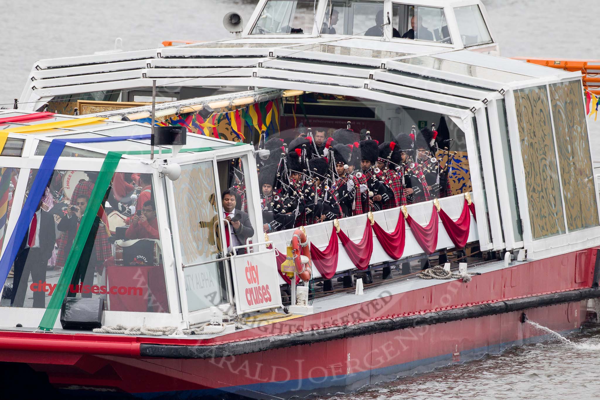 Thames Diamond Jubilee Pageant: SHREE MUKTAJEEVAN PIPE BAND & DHOL ENSEMBLE - City Alpha (H43)..
River Thames seen from Battersea Bridge,
London,

United Kingdom,
on 03 June 2012 at 15:18, image #318