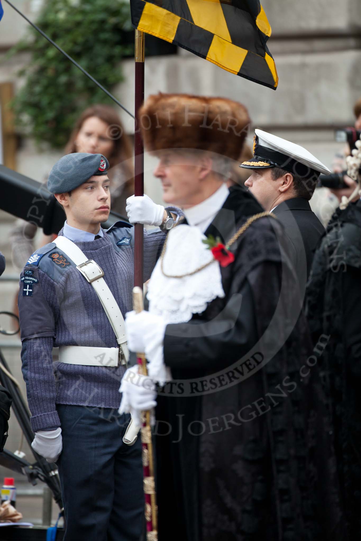The Lord Mayor's Show 2011: A male cadet from 1475 (3rd Lewisham) Squadron of the Air Training Corps, the Dulwich Air Cadets, carrying one of the Heraldic Banners, here seen behind the Sword Bearer, Col. Richard Martin..
Opposite Mansion House, City of London,
London,
-,
United Kingdom,
on 12 November 2011 at 10:54, image #58