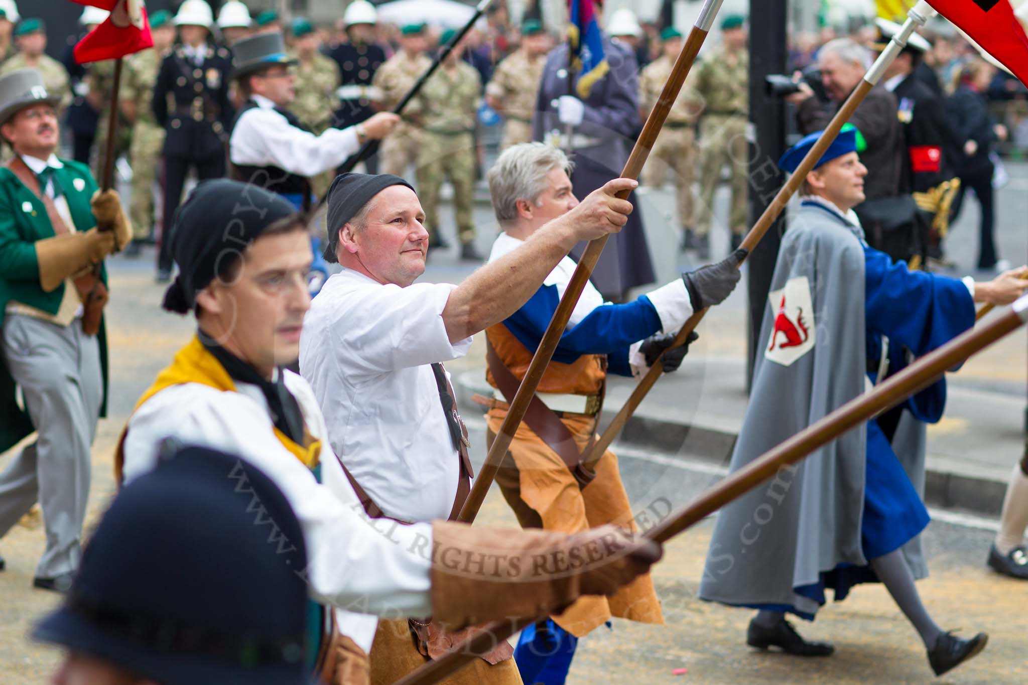 The Lord Mayor's Show 2011: The Guilds of Zurich. Each of the Guilds is represented by a banner, and the banner bearers are leading the procession..
Opposite Mansion House, City of London,
London,
-,
United Kingdom,
on 12 November 2011 at 11:41, image #421
