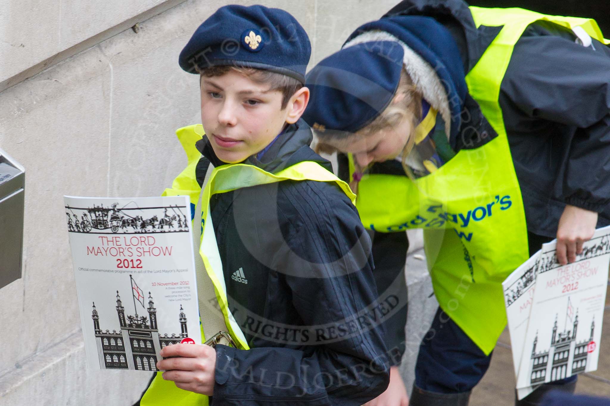 Lord Mayor's Show 2012: Young programme sellers with the official 2012 Lord Mayor's Show programme..
Press stand opposite Mansion House, City of London,
London,
Greater London,
United Kingdom,
on 10 November 2012 at 09:14, image #9