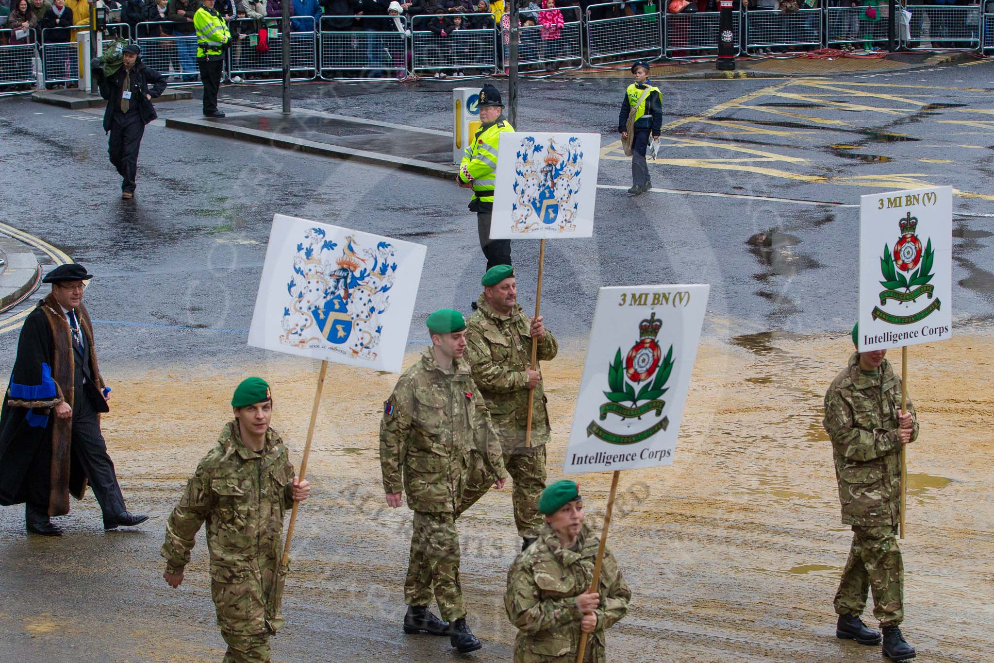 Lord Mayor's Show 2012: Entry 76 - 3 Military Intelligence Battalion (Volunteers) with members of the affiliated Livery Company, The Worshipful Company of Painter Stainers..
Press stand opposite Mansion House, City of London,
London,
Greater London,
United Kingdom,
on 10 November 2012 at 11:33, image #958