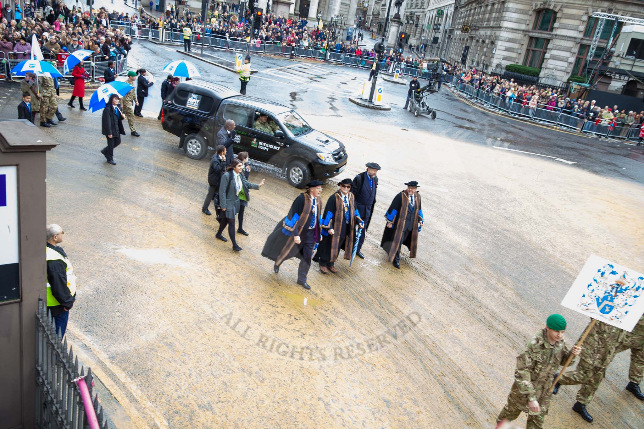 Lord Mayor's Show 2012: Entry 76 - 3 Military Intelligence Battalion (Volunteers) with members of the affiliated Livery Company, The Worshipful Company of Painter Stainers..
Press stand opposite Mansion House, City of London,
London,
Greater London,
United Kingdom,
on 10 November 2012 at 11:33, image #961
