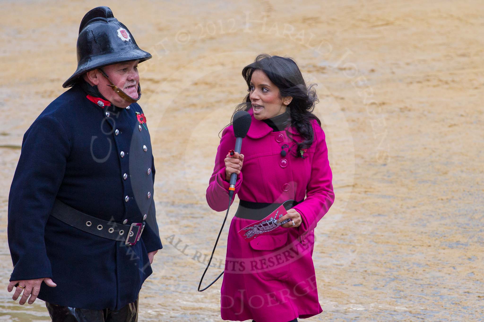 Photo 1211101152381D47579HaraldJoergens Lord Mayor's Show 2012: Entrry 104 - Modern Livery Companies, representing 26 Livery Companies, here with the BBC's Sonali Shah interviewing a fire fighter..
Press stand opposite Mansion House, City of London,
London,
Greater London,
United Kingdom,
on 10 November 2012 at 11:52, image #1459