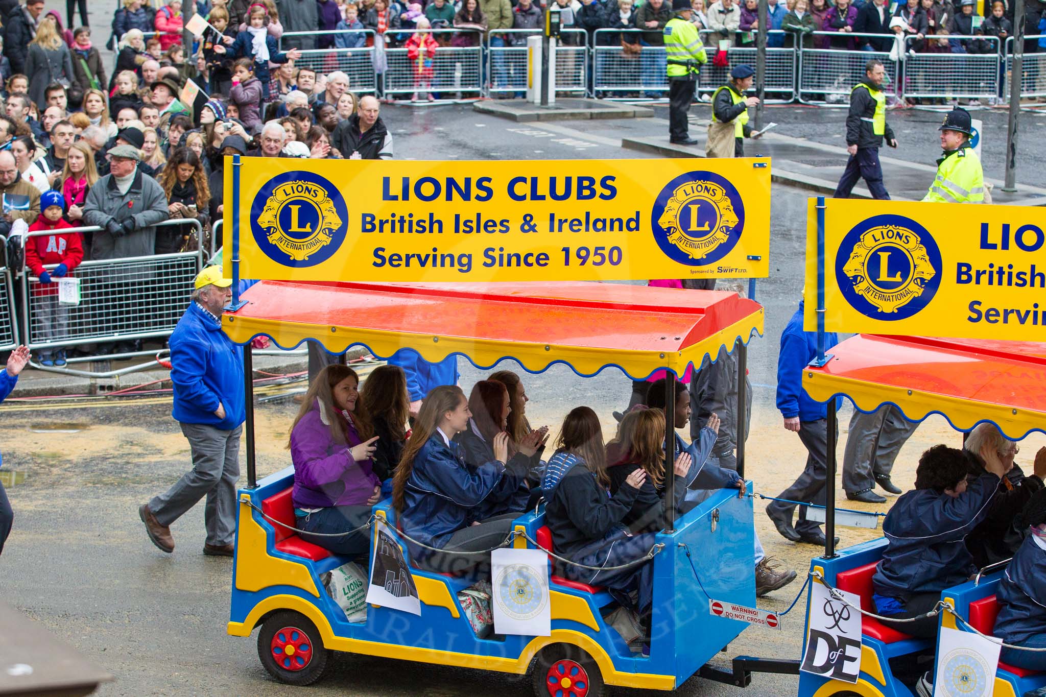 Lord Mayor's Show 2012: Entry 110 - Lions Clubs International..
Press stand opposite Mansion House, City of London,
London,
Greater London,
United Kingdom,
on 10 November 2012 at 11:55, image #1573