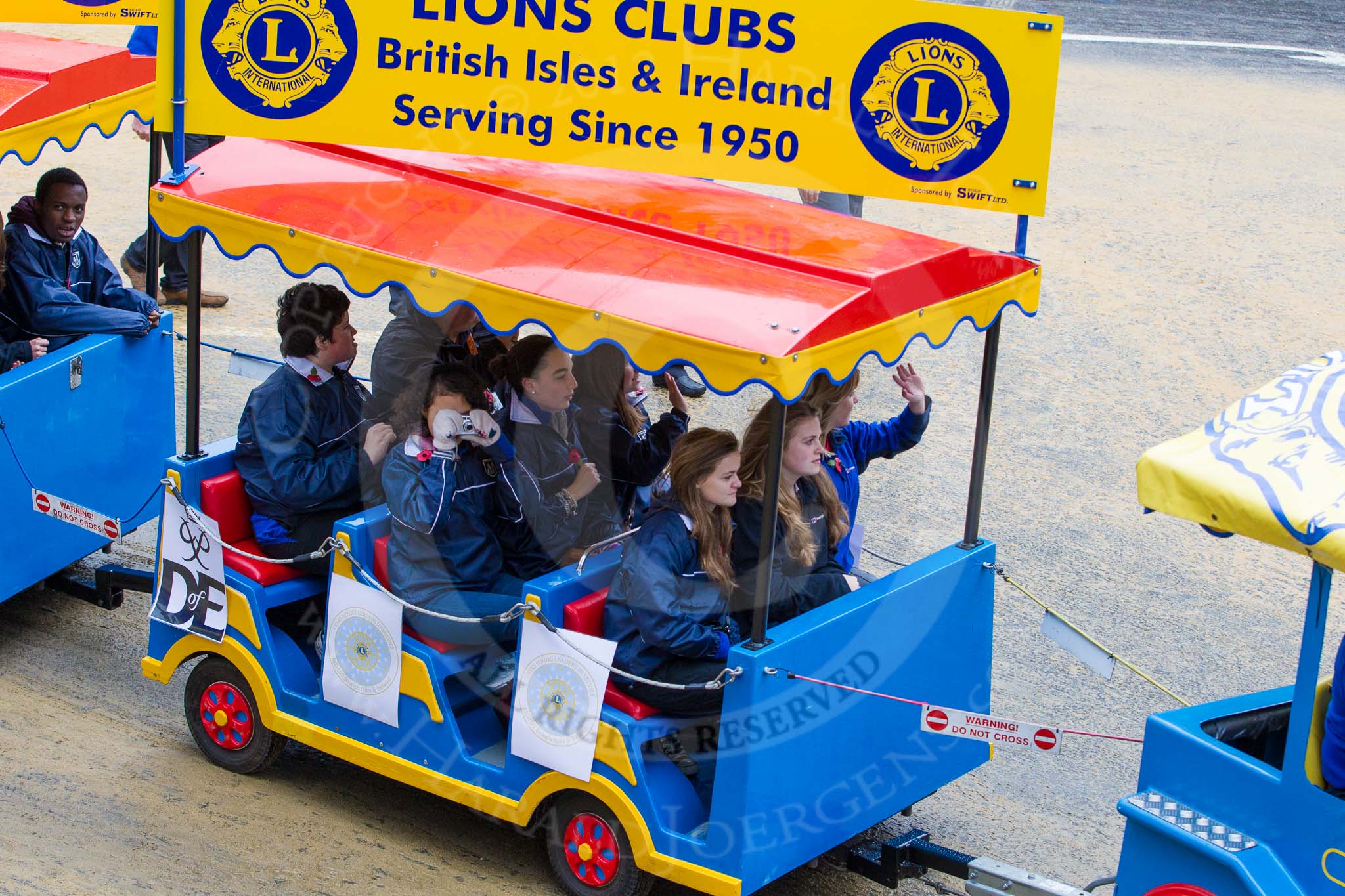 Lord Mayor's Show 2012: Entry 110 - Lions Clubs International..
Press stand opposite Mansion House, City of London,
London,
Greater London,
United Kingdom,
on 10 November 2012 at 11:55, image #1574