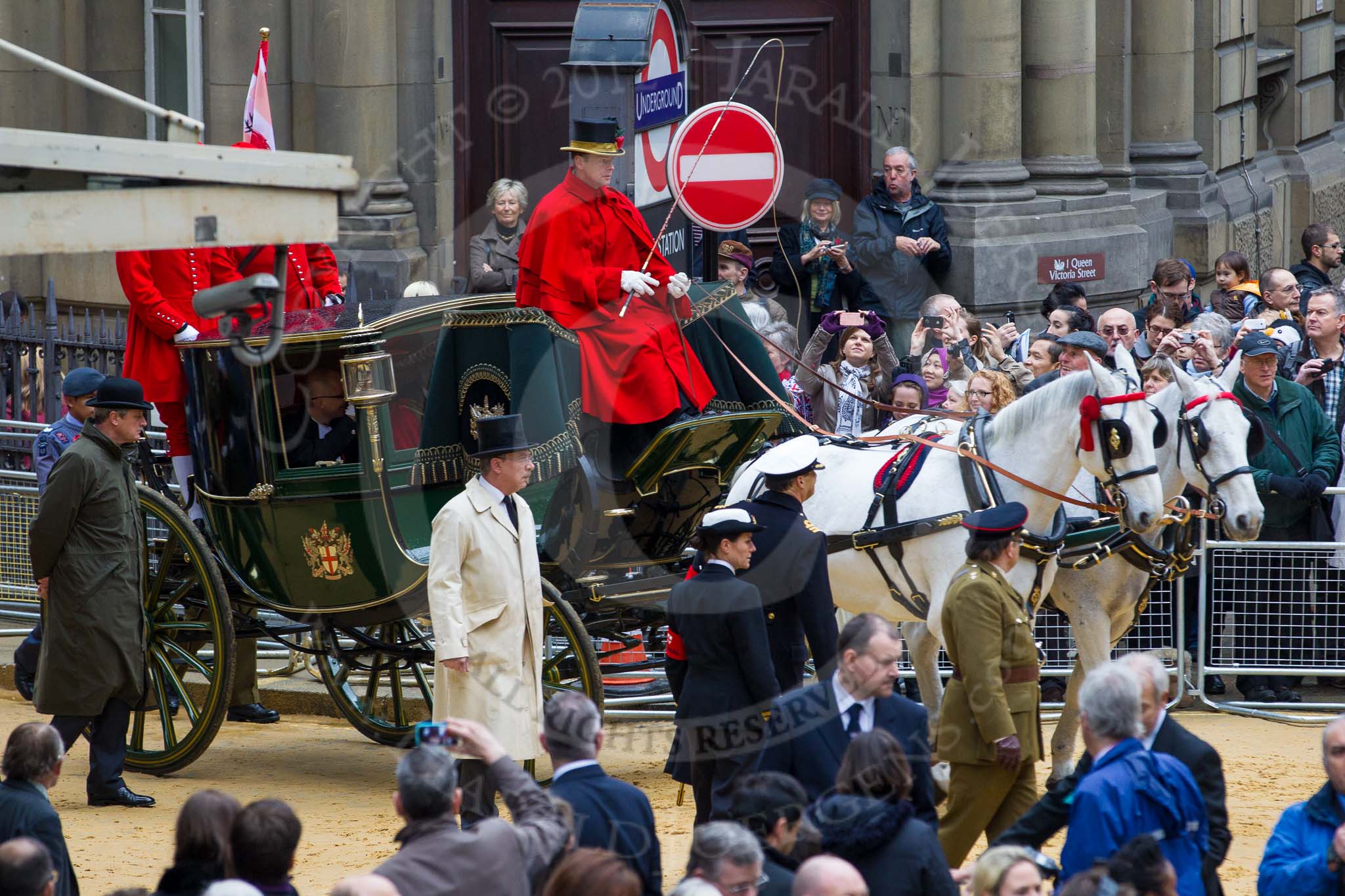 Lord Mayor's Show 2012: Entry 142 - Late Lord Mayor, Alderman and Mrs David Wootton, with the Chaplain Andrew Walker, escorted by four Yeoman Warders and cadets of 1475 (Dulwich) Squadron. Two Dogget's Coat and Badge men stand on the rear of the carriage..
Press stand opposite Mansion House, City of London,
London,
Greater London,
United Kingdom,
on 10 November 2012 at 12:07, image #1900