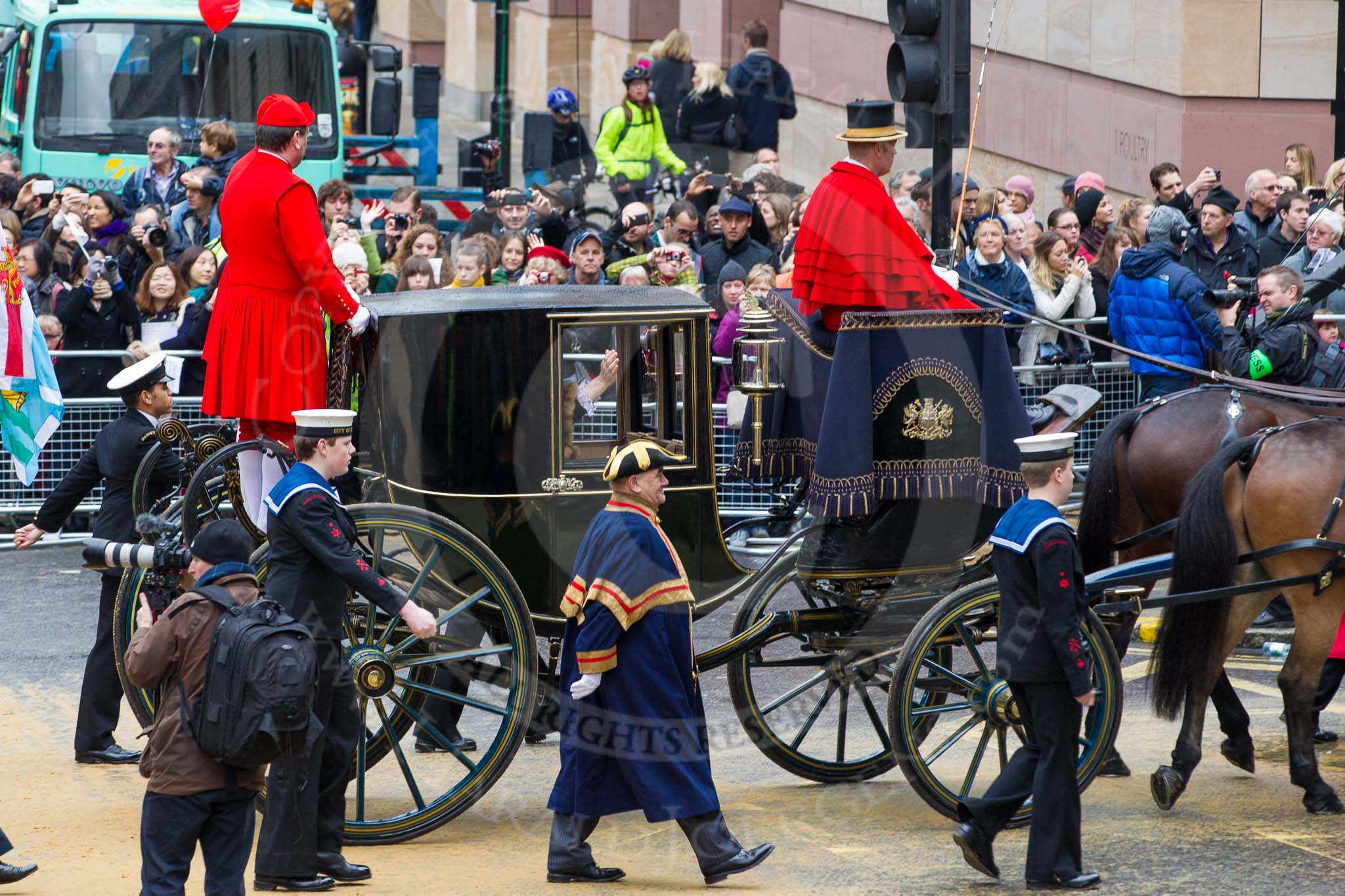 Lord Mayor's Show 2012: Entry 142 - Late Lord Mayor, Alderman and Mrs David Wootton, with the Chaplain Andrew Walker, escorted by four Yeoman Warders and cadets of 1475 (Dulwich) Squadron. Two Dogget's Coat and Badge men stand on the rear of the carriage..
Press stand opposite Mansion House, City of London,
London,
Greater London,
United Kingdom,
on 10 November 2012 at 12:08, image #1905
