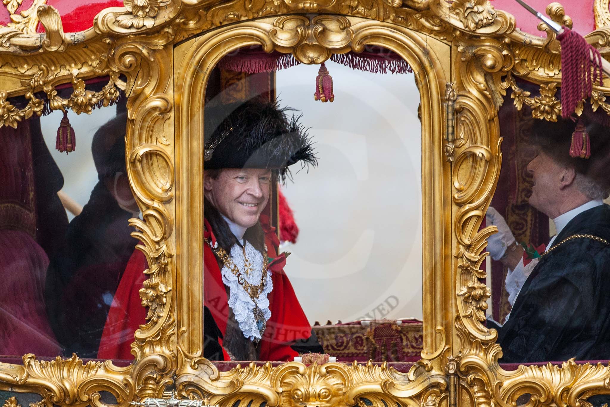 Lord Mayor's Show 2012: Lord Mayor Roger Gifford waving from his carriage as he is about to leave for St Paul's Cathedral..
Press stand opposite Mansion House, City of London,
London,
Greater London,
United Kingdom,
on 10 November 2012 at 12:12, image #1948