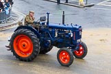 Lord Mayor's Show 2012: Entrry 104 - Modern Livery Companies, representing 26 Livery Companies, here the farmers with  1950 Fordson Major tractor..
Press stand opposite Mansion House, City of London,
London,
Greater London,
United Kingdom,
on 10 November 2012 at 11:52, image #1451