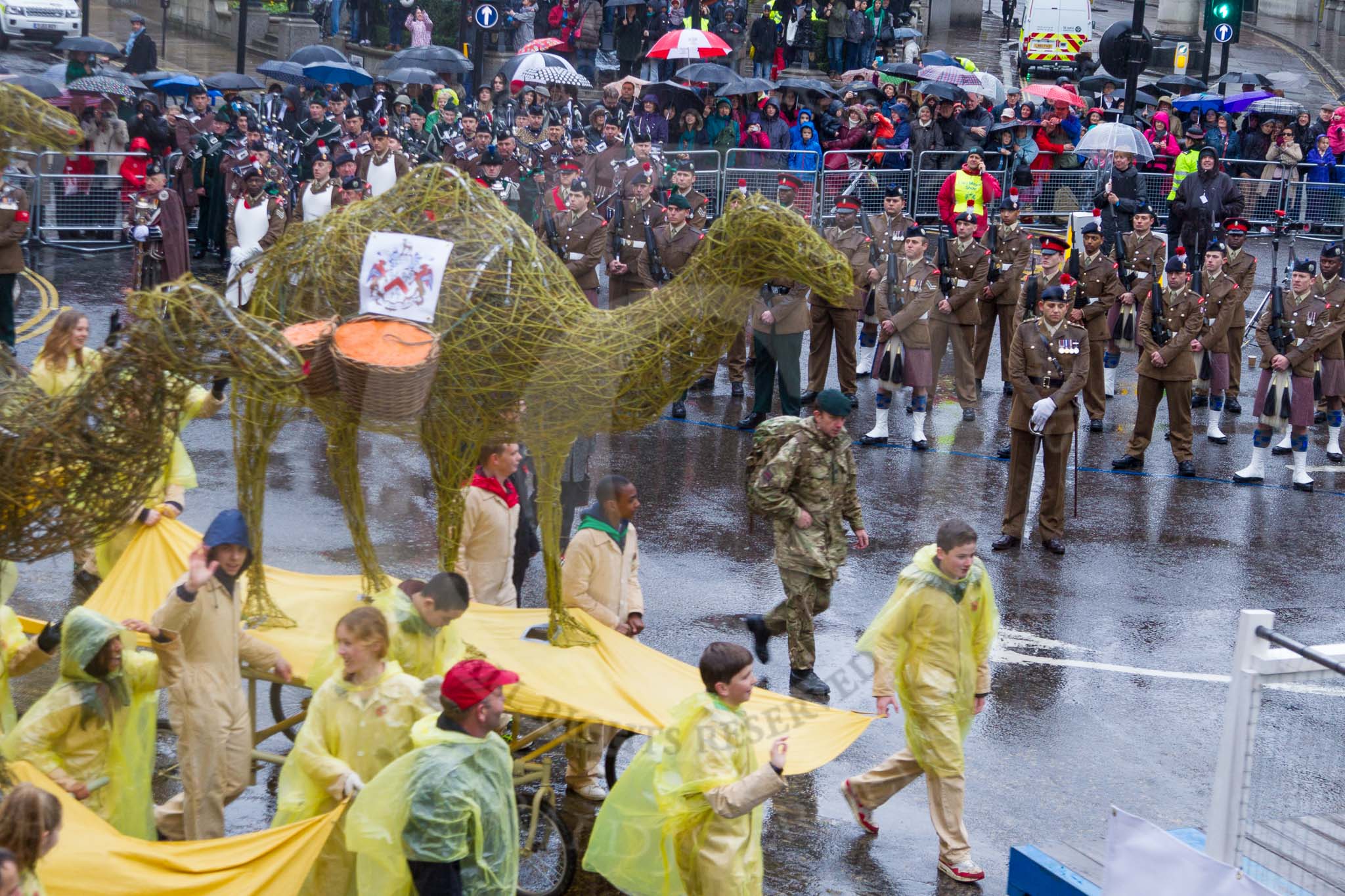 Lord Mayor's Show 2013: 6-Worshipful Company of Grocers- The Spice of Life, represented by the Coldstream Guards, G Company 7th Rifles and participants from Oundle School and Mossbourne Academy..
Press stand opposite Mansion House, City of London,
London,
Greater London,
United Kingdom,
on 09 November 2013 at 11:02, image #179
