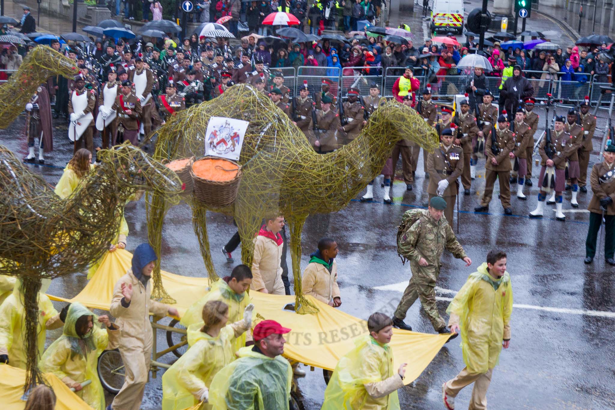 Lord Mayor's Show 2013: 6-Worshipful Company of Grocers- The Spice of Life, represented by the Coldstream Guards, G Company 7th Rifles and participants from Oundle School and Mossbourne Academy..
Press stand opposite Mansion House, City of London,
London,
Greater London,
United Kingdom,
on 09 November 2013 at 11:02, image #180