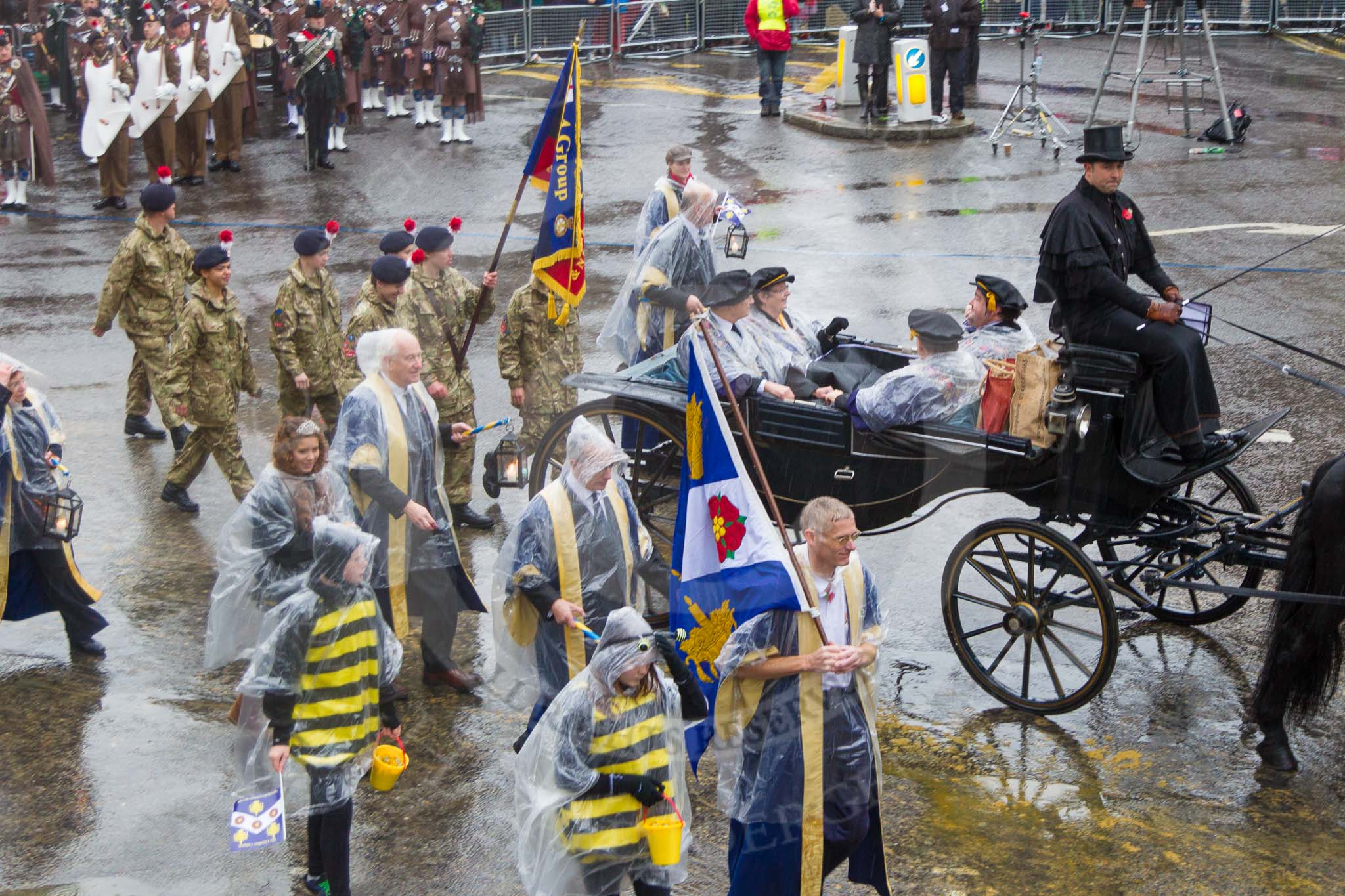 Lord Mayor's Show 2013: 11-Worshipful Company of Wax Chandlers- orginally based on the beeswax trade with representatives from 5 Rifles and British wax industry..
Press stand opposite Mansion House, City of London,
London,
Greater London,
United Kingdom,
on 09 November 2013 at 11:05, image #244