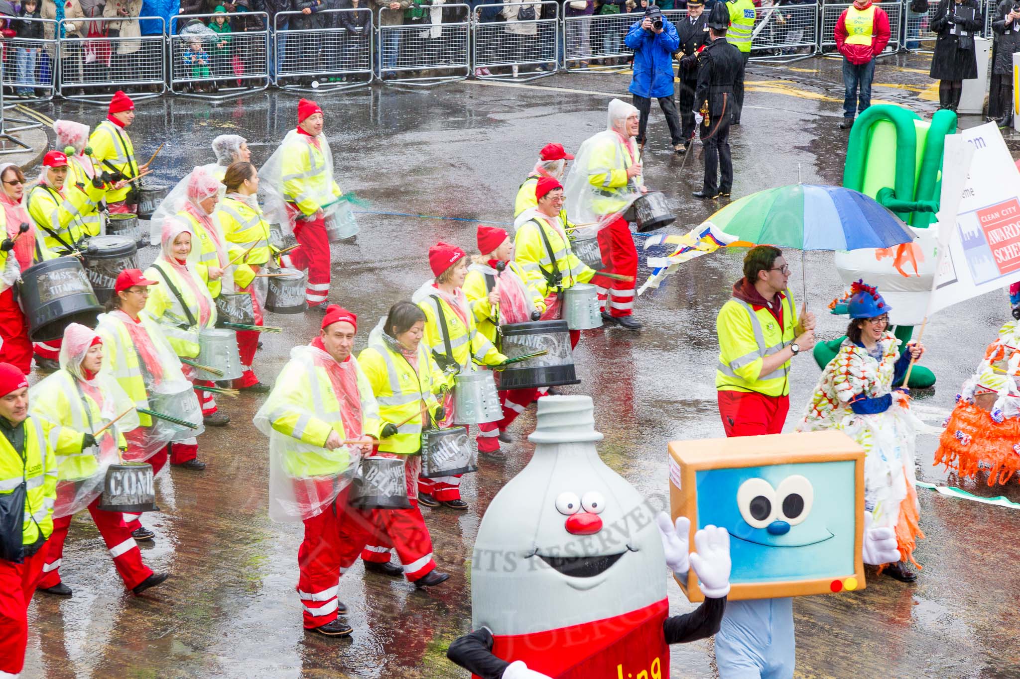 Lord Mayor's Show 2013: 59-Recycling in the City- The Binbot is joined again by his drumming street sweepers to celebrate 20th anniversary of the City's unique Clean City Awards scheme..
Press stand opposite Mansion House, City of London,
London,
Greater London,
United Kingdom,
on 09 November 2013 at 11:31, image #735