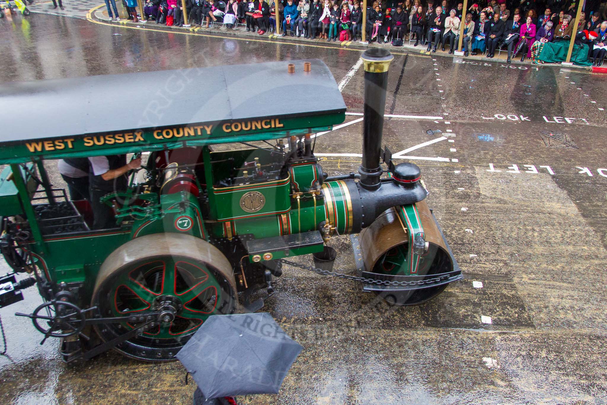 Lord Mayor's Show 2013: 70-Worshipful Company of Paviors-which brings together construction-industry professionals involved with roads and pavements.This year's float features the 'pig' that mediaeval paviors would have cleared from city streets and it towed by a steamroller from Amberley museum..
Press stand opposite Mansion House, City of London,
London,
Greater London,
United Kingdom,
on 09 November 2013 at 11:39, image #852