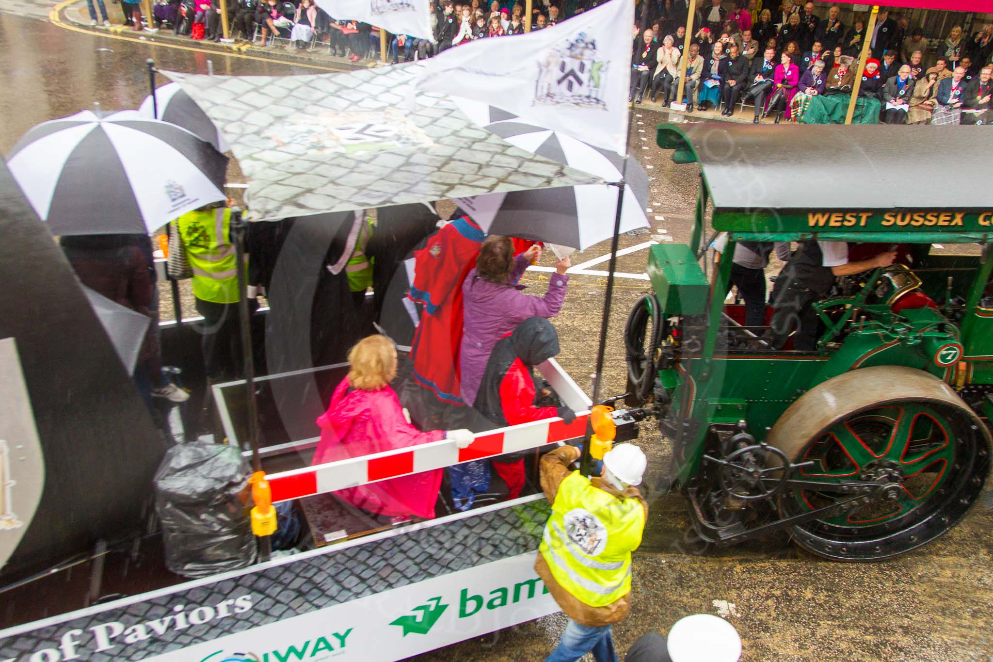 Lord Mayor's Show 2013: 70-Worshipful Company of Paviors-which brings together construction-industry professionals involved with roads and pavements.This year's float features the 'pig' that mediaeval paviors would have cleared from city streets and it towed by a steamroller from Amberley museum..
Press stand opposite Mansion House, City of London,
London,
Greater London,
United Kingdom,
on 09 November 2013 at 11:39, image #855