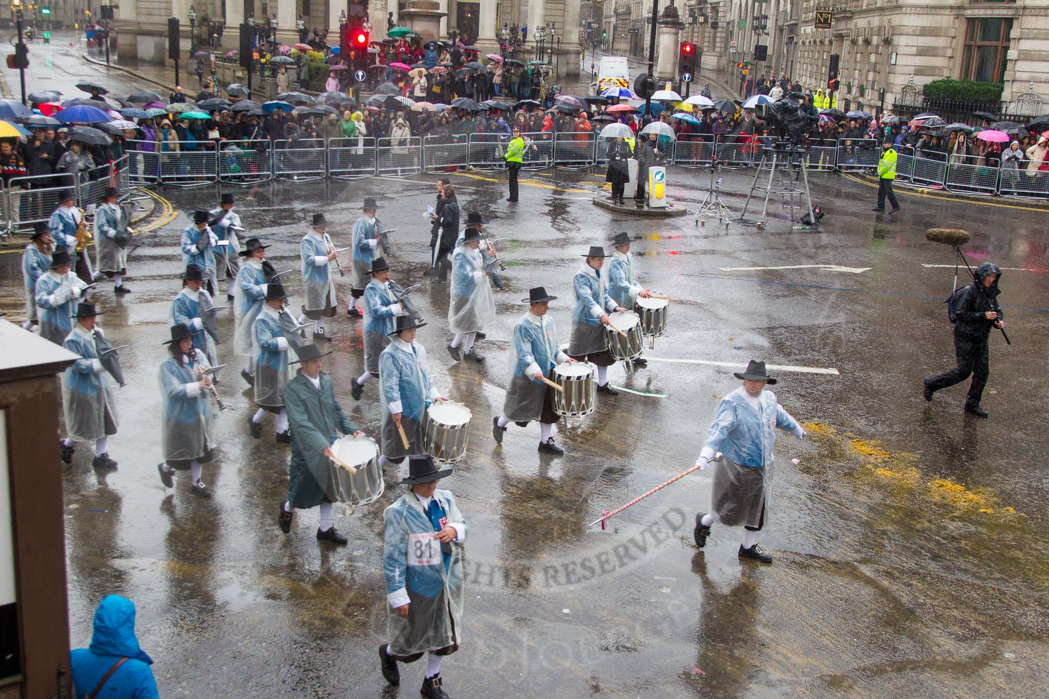 Lord Mayor's Show 2013: 81-Zunft Zur Zimmerleuten Band- the band traditionally supports the Zurich Swiss Gild of the Zimmerleuten in its parade and pageants, and is continuing that tradition today..
Press stand opposite Mansion House, City of London,
London,
Greater London,
United Kingdom,
on 09 November 2013 at 11:45, image #967