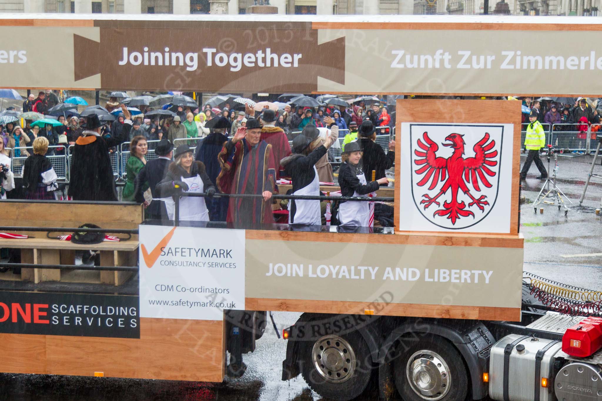 Lord Mayor's Show 2013: 82-Worshipful Company Of Joiners & Ceilers with Zunft Zur Zimmerleuten- the Joiners and Ceilers celebrates its long association with the Swiss Guild of the Zimmerleuten with a troop of horseman and latge contingnet of members in traditional costumes..
Press stand opposite Mansion House, City of London,
London,
Greater London,
United Kingdom,
on 09 November 2013 at 11:46, image #1001