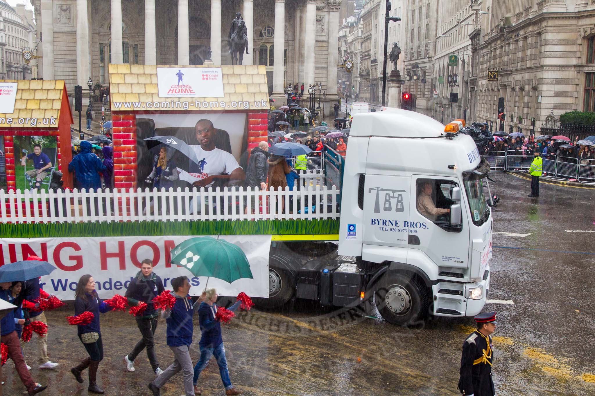 Lord Mayor's Show 2013: 92- Coming Home- is the fundraising campaign for the Haig Housing Trust, which provides housing help for severely wounded heroes.Kindly sponsored by Knight Frank..
Press stand opposite Mansion House, City of London,
London,
Greater London,
United Kingdom,
on 09 November 2013 at 11:50, image #1117